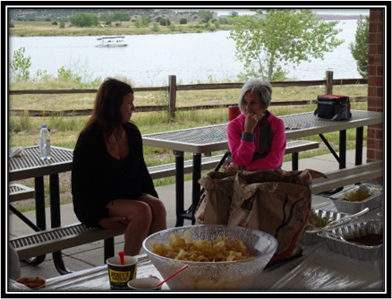 A group of women sitting on benches

Description automatically generated