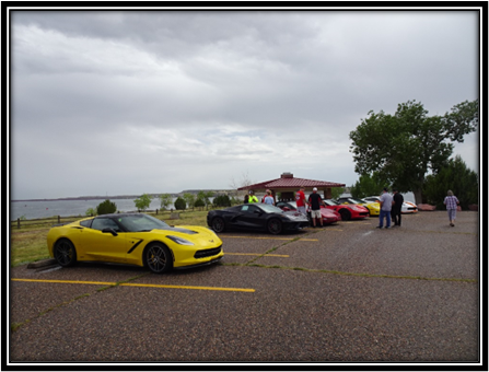 A group of cars parked in a parking lot

Description automatically generated