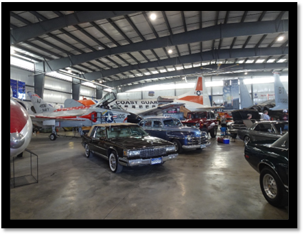 A group of cars in a hangar

AI-generated content may be incorrect.