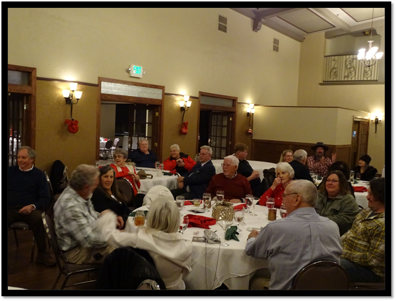 A group of people sitting around a table

AI-generated content may be incorrect.
