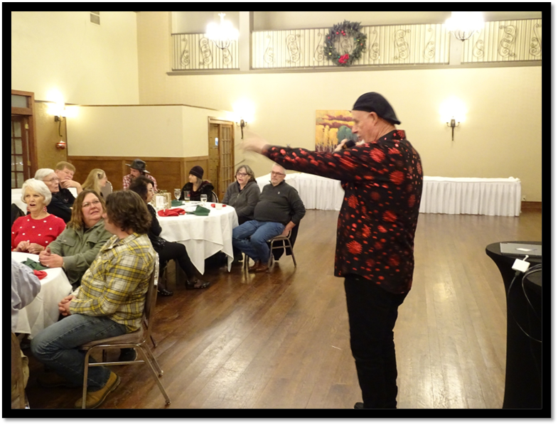 A person standing in front of a group of people

AI-generated content may be incorrect.