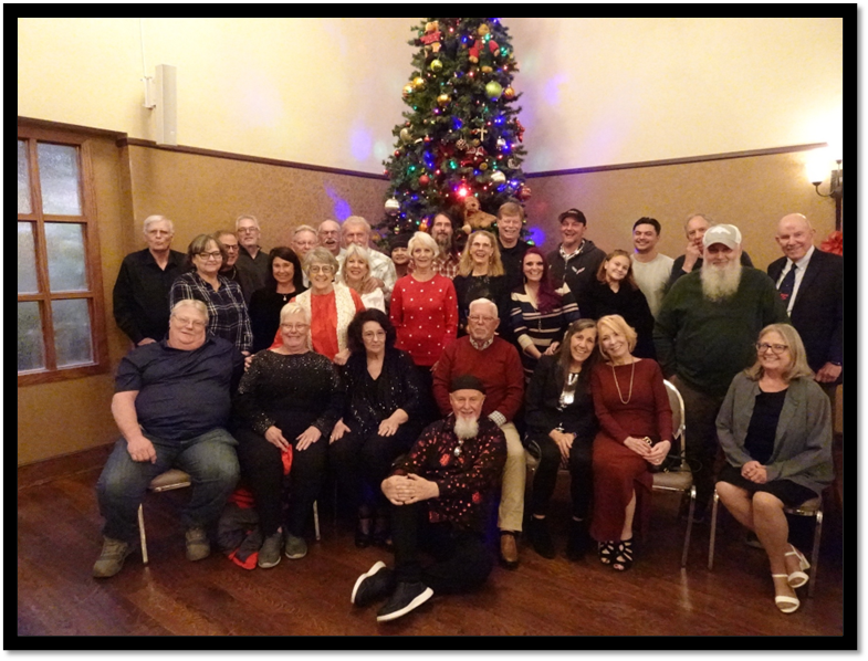 A group of people posing for a photo

AI-generated content may be incorrect.