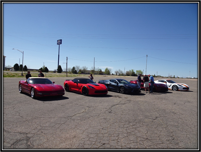 A group of cars parked on a road

Description automatically generated with low confidence