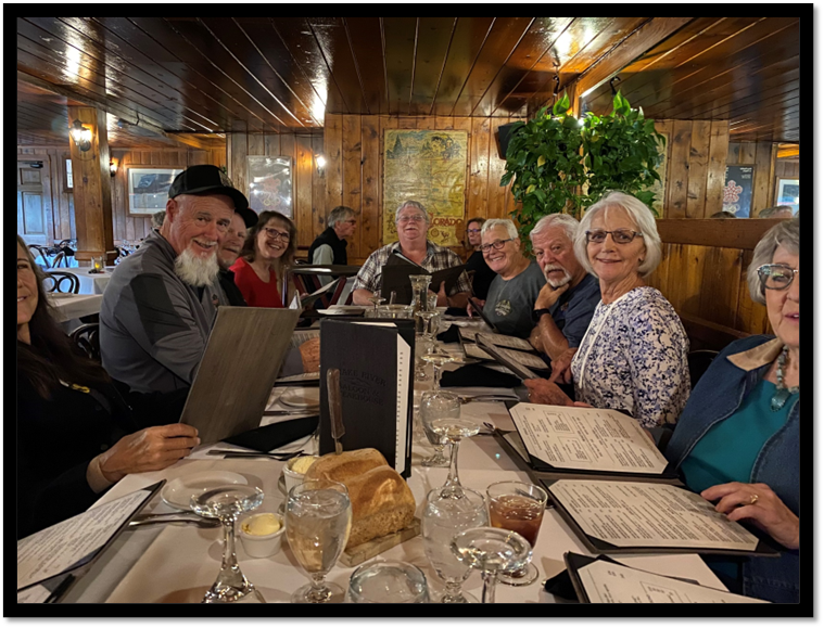 A group of people sitting at a table

Description automatically generated