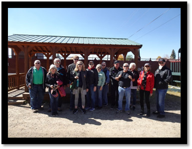 A group of people posing for a photo

Description automatically generated
