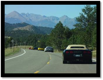 A group of cars on a road

Description automatically generated