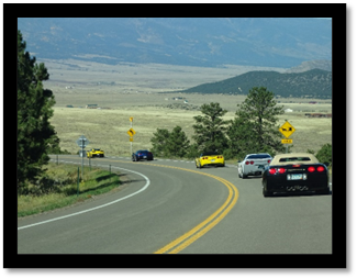 A group of cars on a road

Description automatically generated