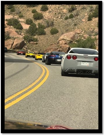 A group of cars on a road

AI-generated content may be incorrect.