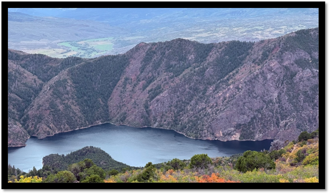 A lake surrounded by mountains

AI-generated content may be incorrect.