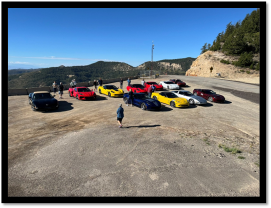 A group of cars parked on a hill

AI-generated content may be incorrect.
