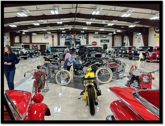 A room with many cars and motorcycles

AI-generated content may be incorrect.