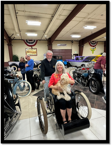 A person and person sitting in a wheelchair with a dog

AI-generated content may be incorrect.