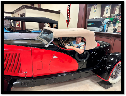 A person in a car

AI-generated content may be incorrect.