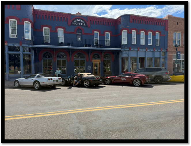 A building with cars parked in front of it

AI-generated content may be incorrect.