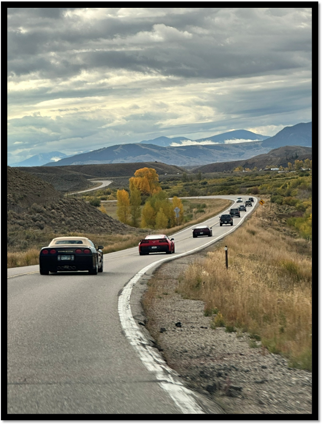 Cars on a road with mountains in the background

AI-generated content may be incorrect.