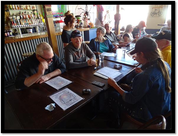 A group of people sitting at a table

Description automatically generated with medium confidence