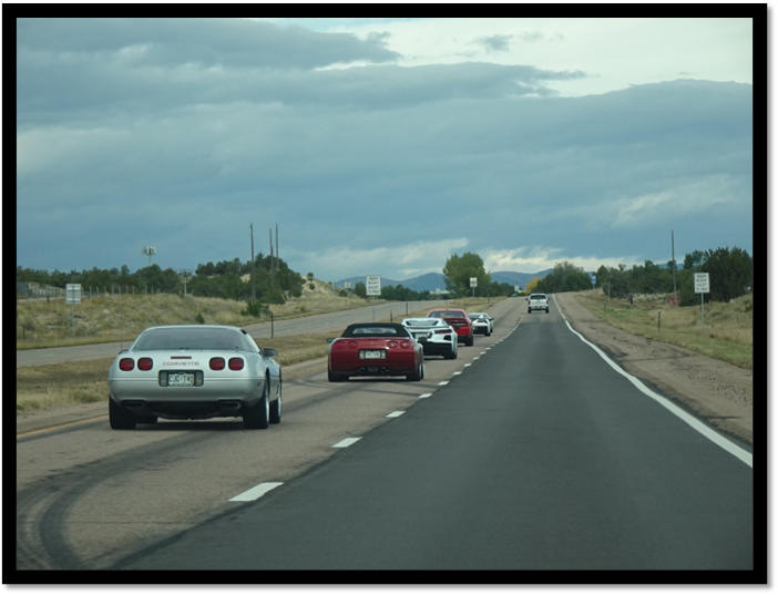 Long shot of cars on a road

AI-generated content may be incorrect.