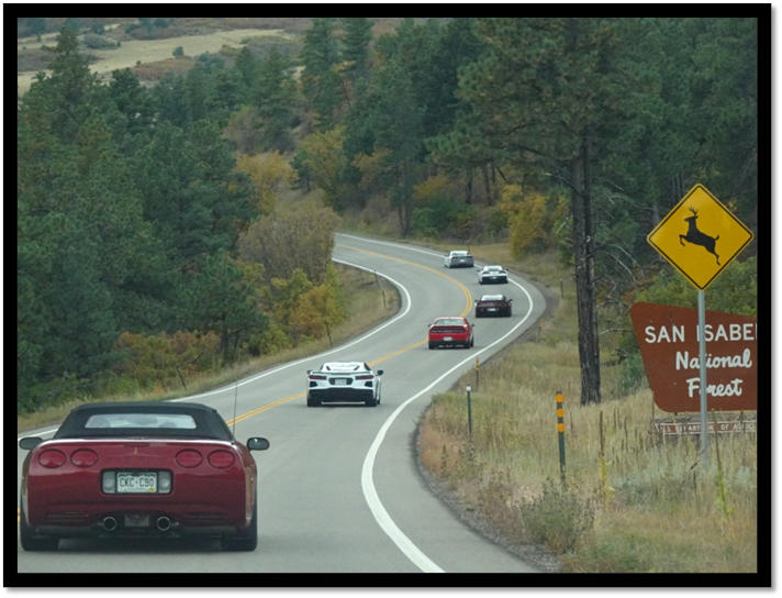 A group of cars on a road

AI-generated content may be incorrect.