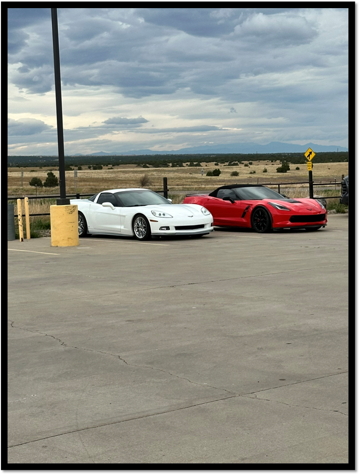 A white and red sports cars parked in a parking lot

AI-generated content may be incorrect.
