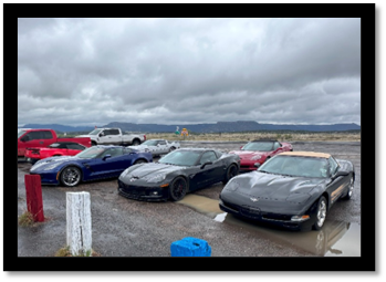 A group of cars parked in a parking lot

Description automatically generated