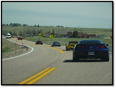 A group of cars on a road

AI-generated content may be incorrect.