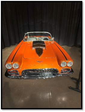 An orange convertible car on a stage

AI-generated content may be incorrect.