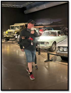 A person standing in a room with cars

AI-generated content may be incorrect.