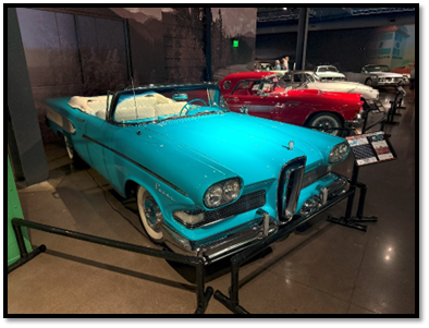 A blue convertible car on display

AI-generated content may be incorrect.
