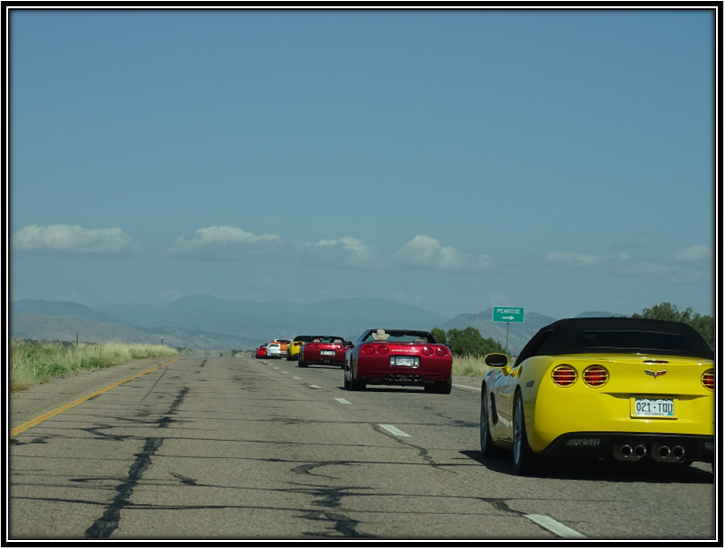 A group of cars on a road

Description automatically generated