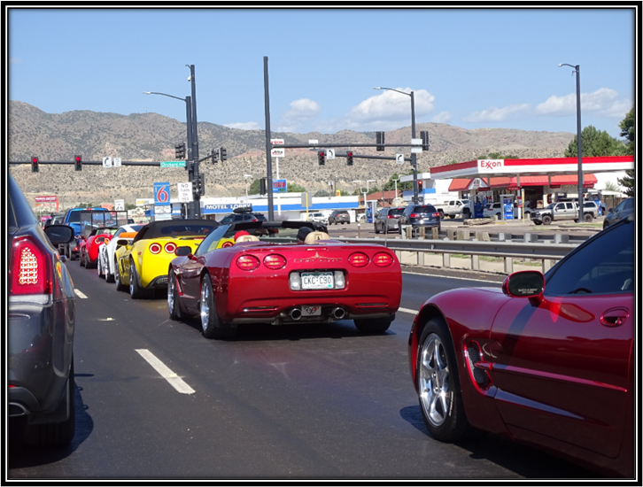 A group of cars on a road

Description automatically generated