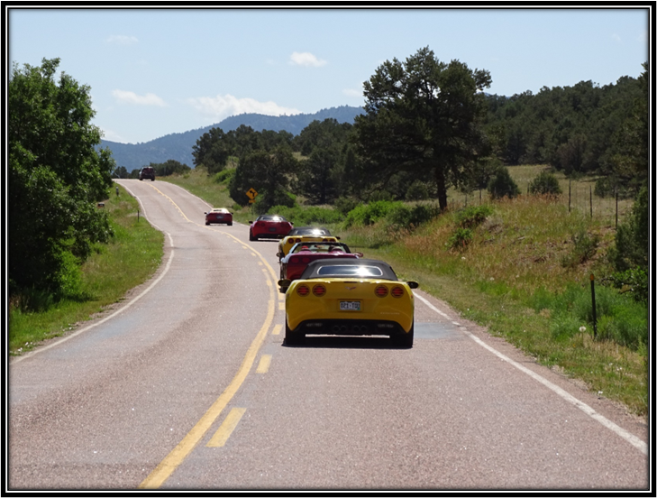 A group of cars on a road

Description automatically generated