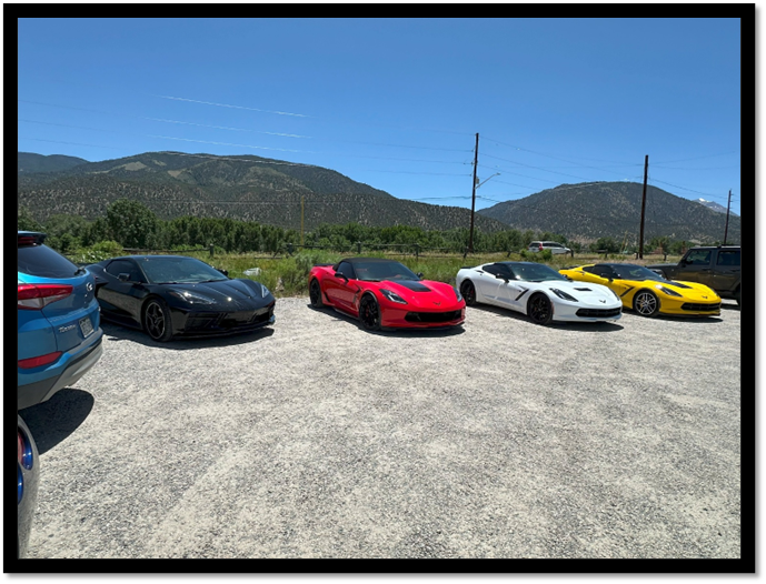 A group of cars parked in a row

AI-generated content may be incorrect.