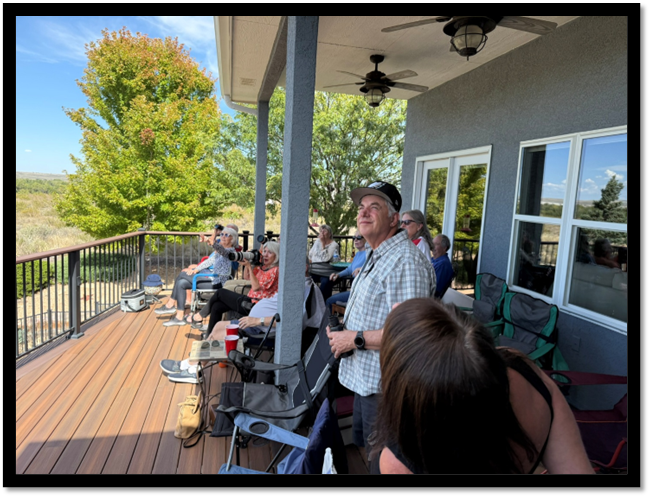 A group of people sitting on a porch

AI-generated content may be incorrect.