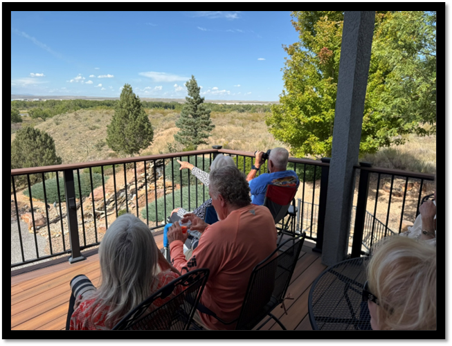 A group of people sitting on a deck

AI-generated content may be incorrect.