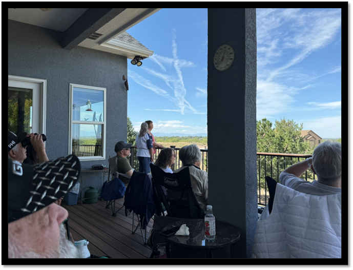 A group of people sitting on a porch

AI-generated content may be incorrect.