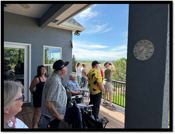 A group of people standing on a deck

AI-generated content may be incorrect.