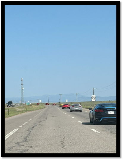 A group of cars on a road

AI-generated content may be incorrect.