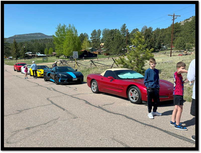 A group of cars parked on a road

AI-generated content may be incorrect.