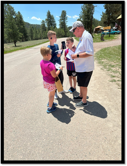 A group of people standing on a road

AI-generated content may be incorrect.