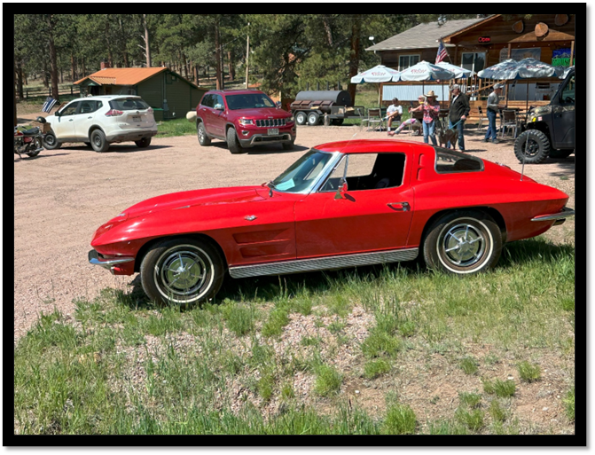 A red car parked in a parking lot

AI-generated content may be incorrect.