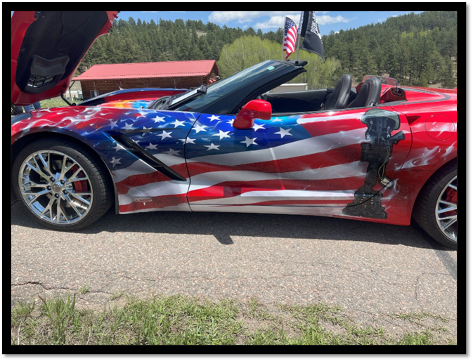 A car with a flag painted on it

AI-generated content may be incorrect.