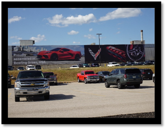 A large billboard with cars on it

Description automatically generated