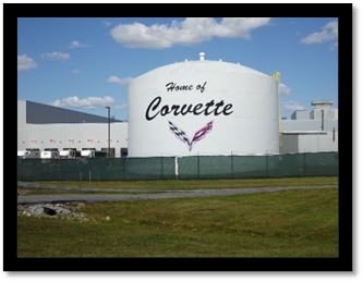 A large white silo with a logo on it

Description automatically generated