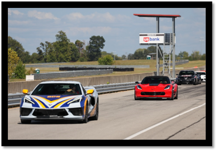 A race car on a road

Description automatically generated