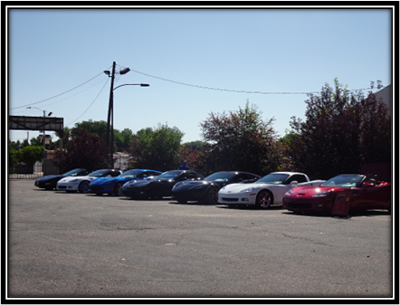 A row of cars parked in a parking lot

Description automatically generated with medium confidence