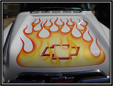 A hood of a car with flames on it

Description automatically generated with medium confidence