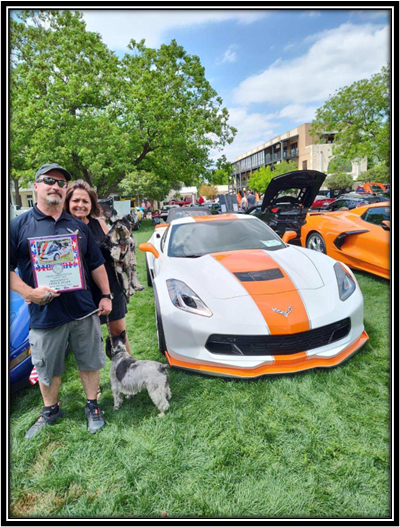 A person and person standing next to a car

Description automatically generated with low confidence