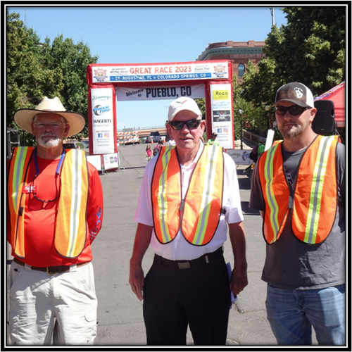 A group of men wearing orange vests and hats

Description automatically generated with medium confidence