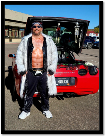 A person standing in front of a car

Description automatically generated