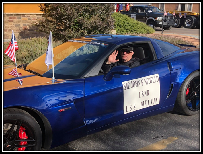 A person driving a blue car

Description automatically generated with medium confidence